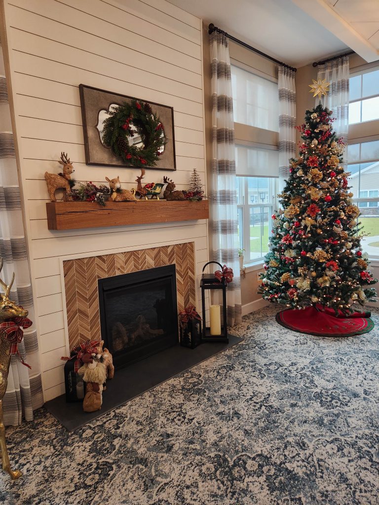 Cozy holiday decor with a Christmas tree and fireplace