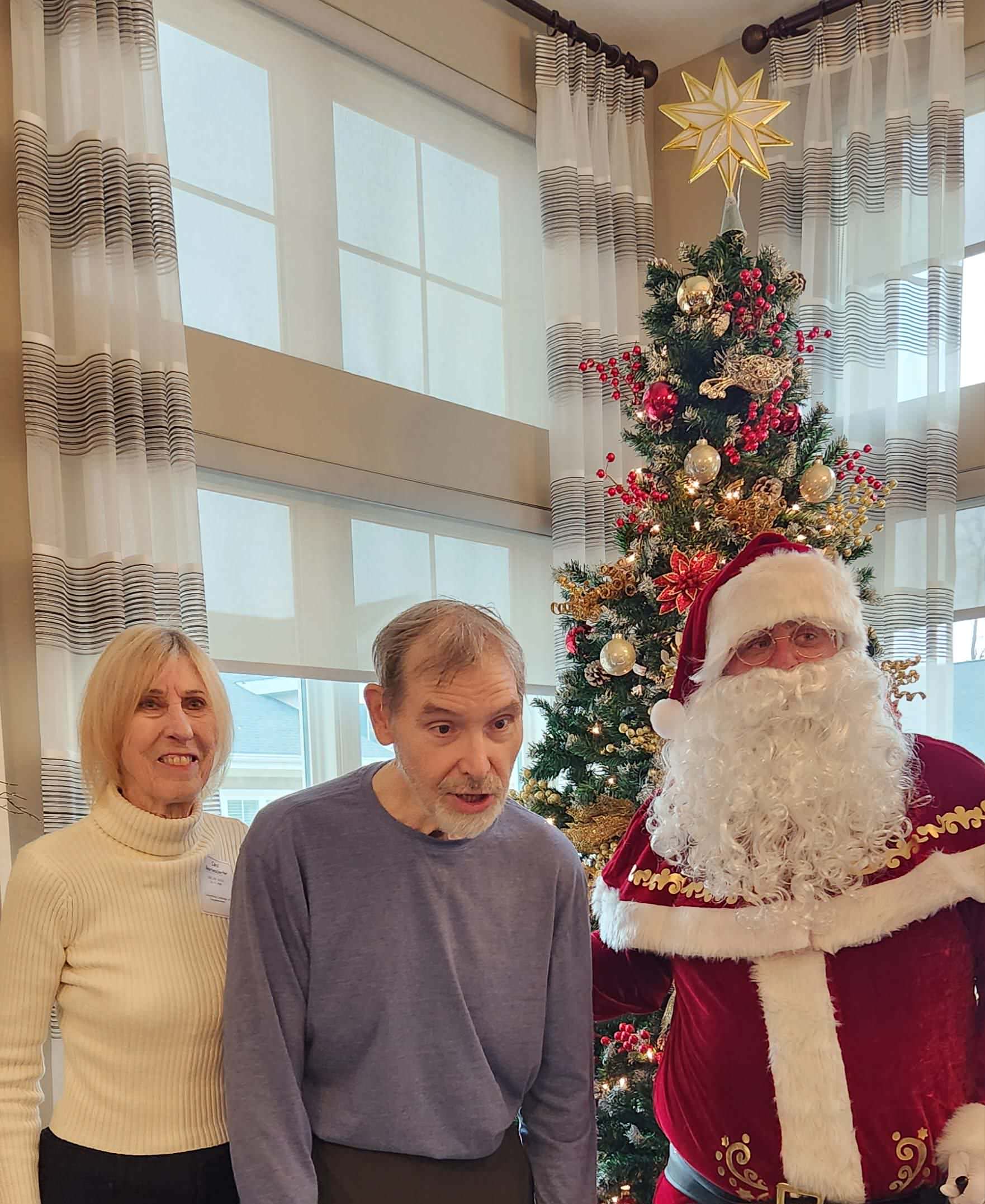 Residents celebrating Christmas with Santa Claus.