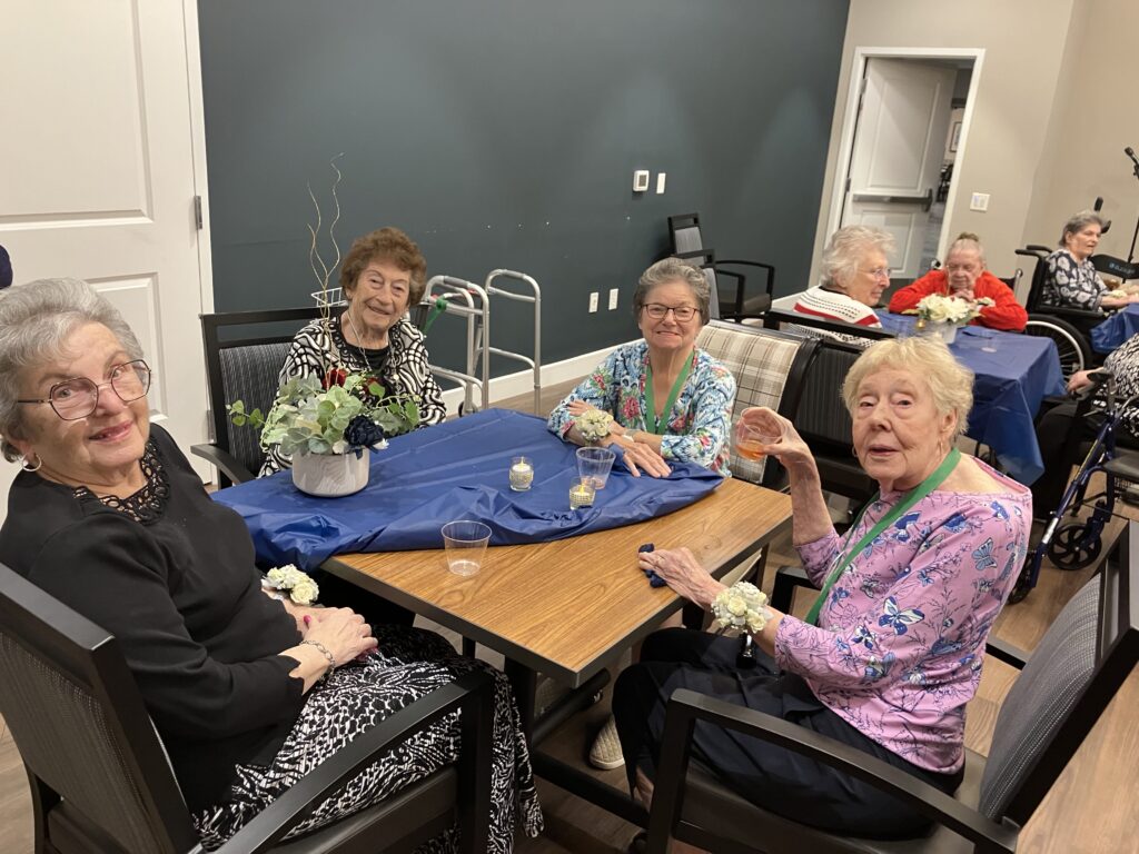 Seniors enjoying a gathering with smiles