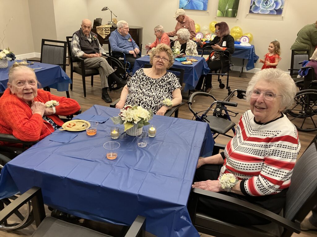 Residents enjoying food at a social event.