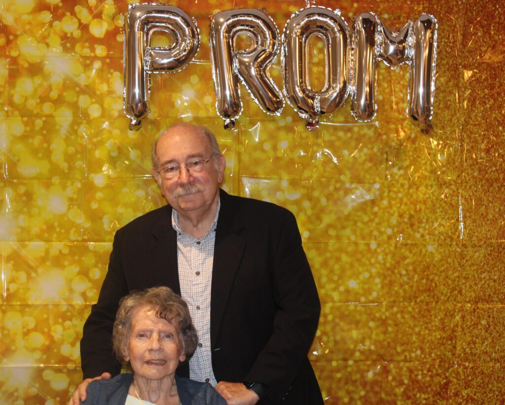 Older couple posing at a prom event