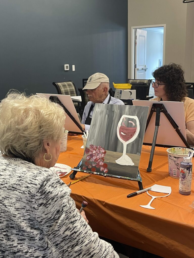 Residents painting together during an activity session