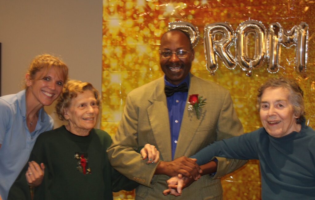 Residents enjoying an event with staff.