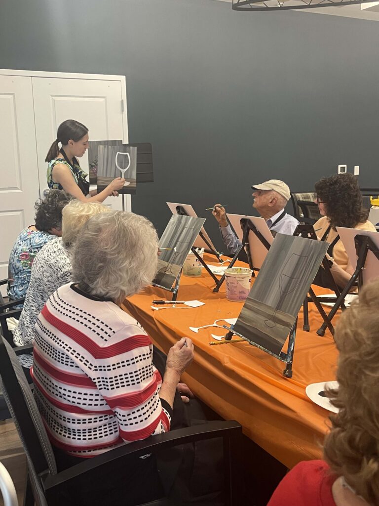 Residents participating in an art activity class