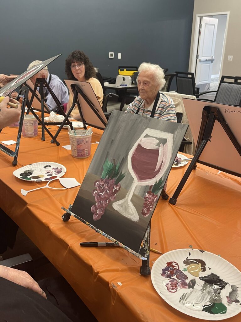 Residents participating in a painting activity