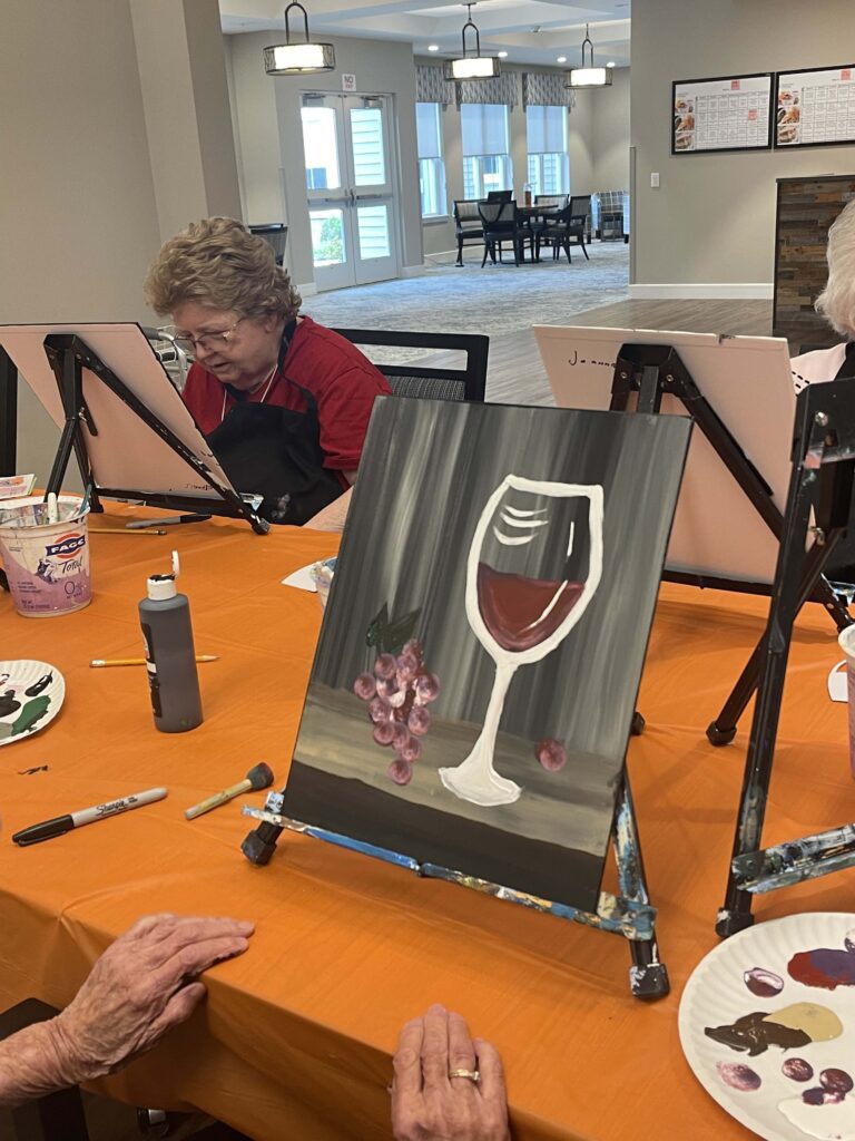 Residents painting during an art activity session.