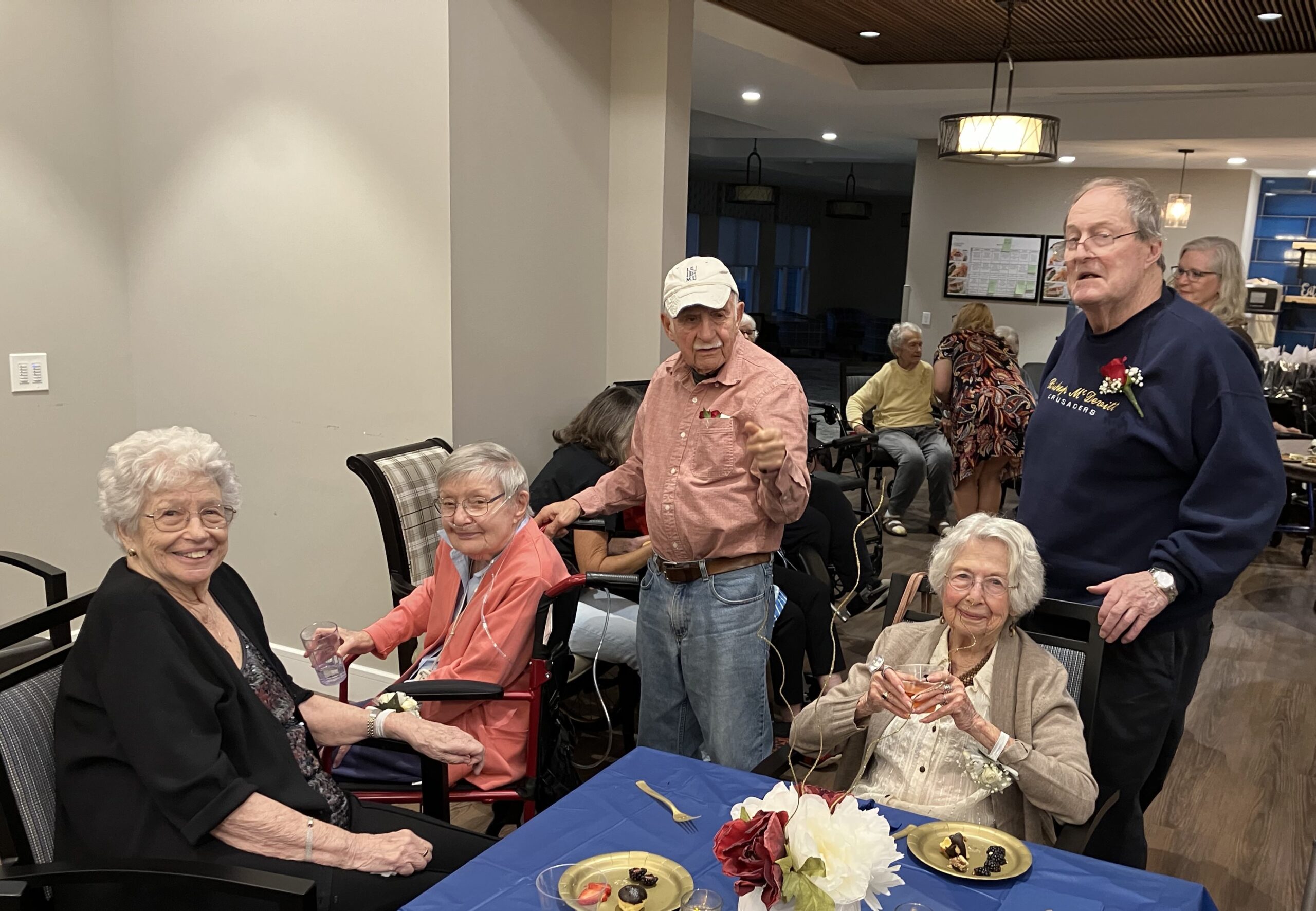 Residents enjoying social time with food and drinks.