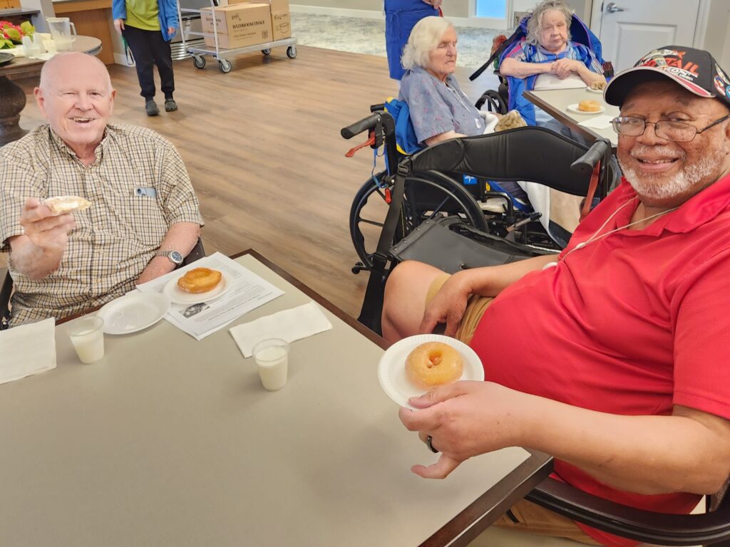 Residents enjoying donuts and milk in common area