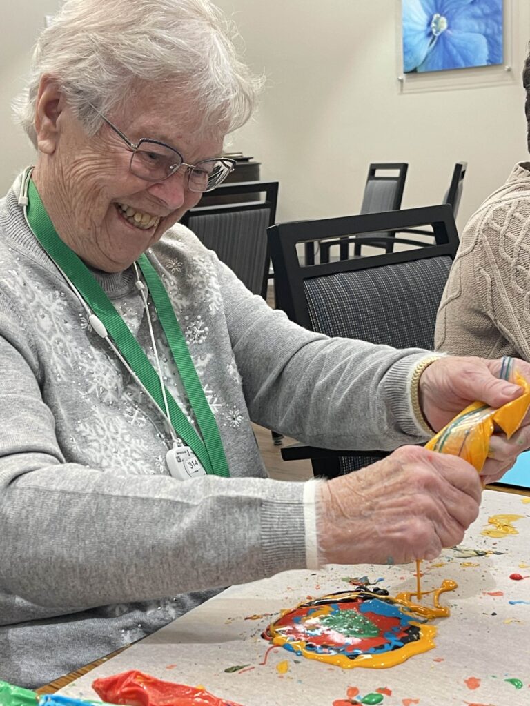 Senior resident engaging in a creative activity