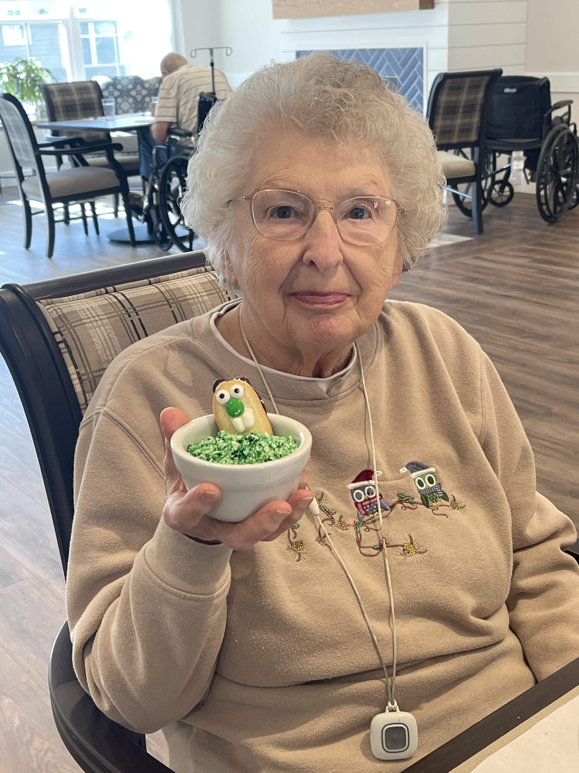 Senior resident enjoying a festive dessert treat.