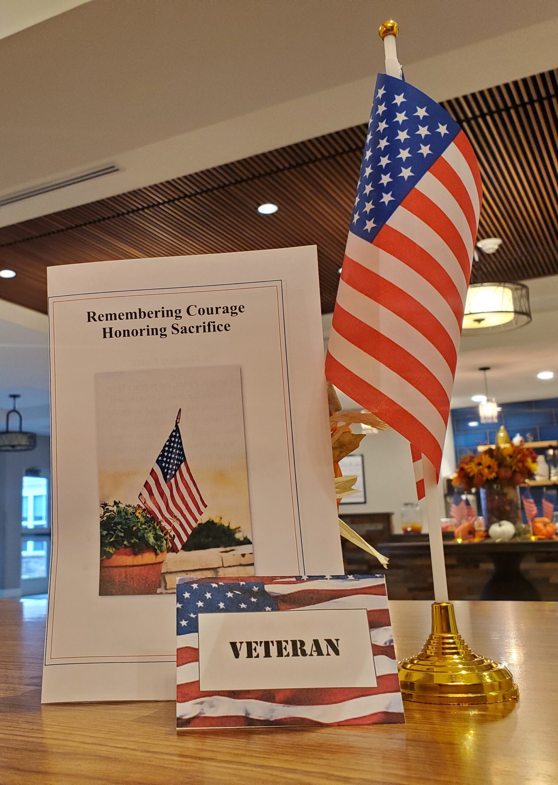 Veteran's display with American flag and sign.