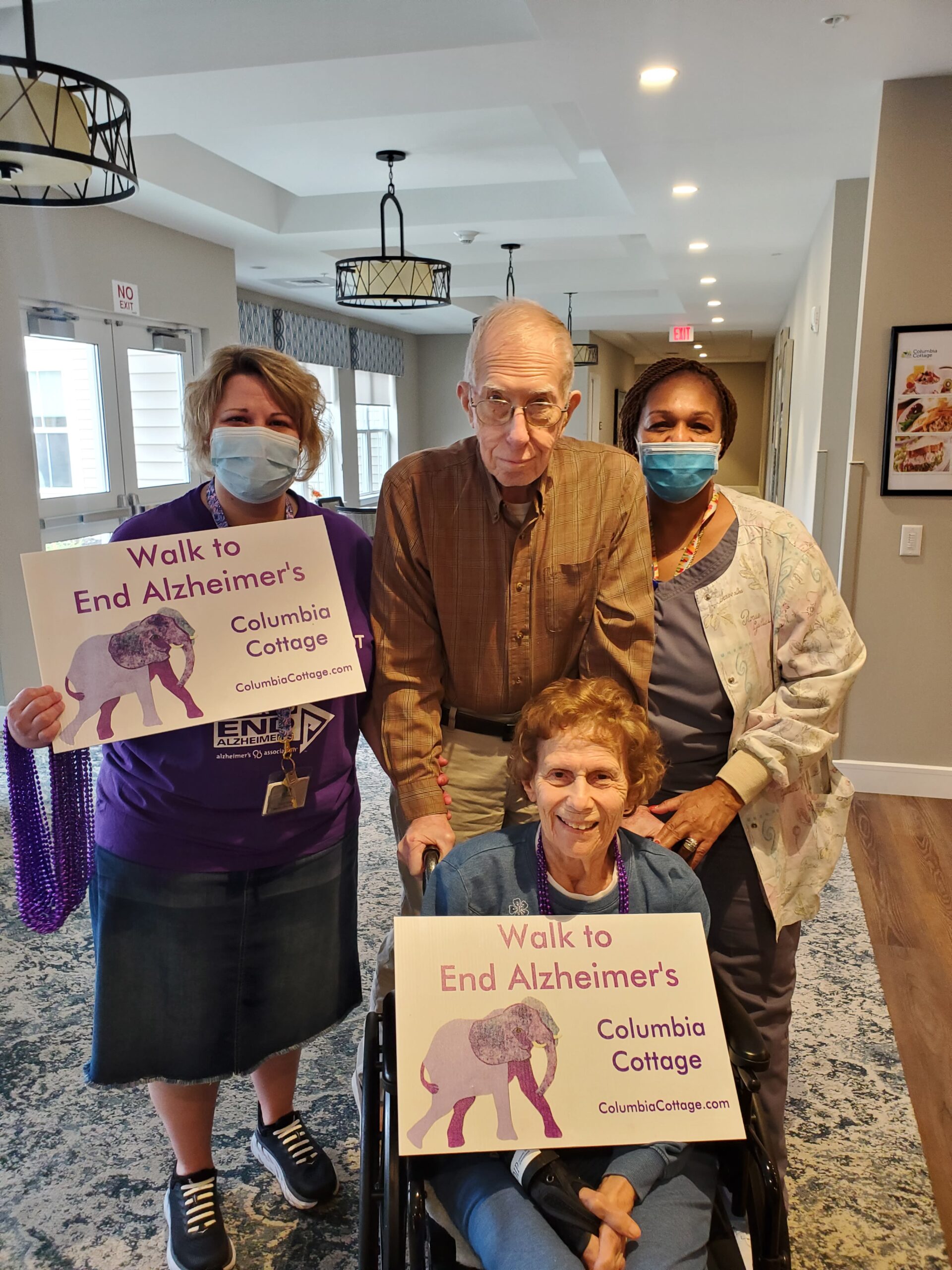 Residents and staff participating in an Alzheimer's awareness event.