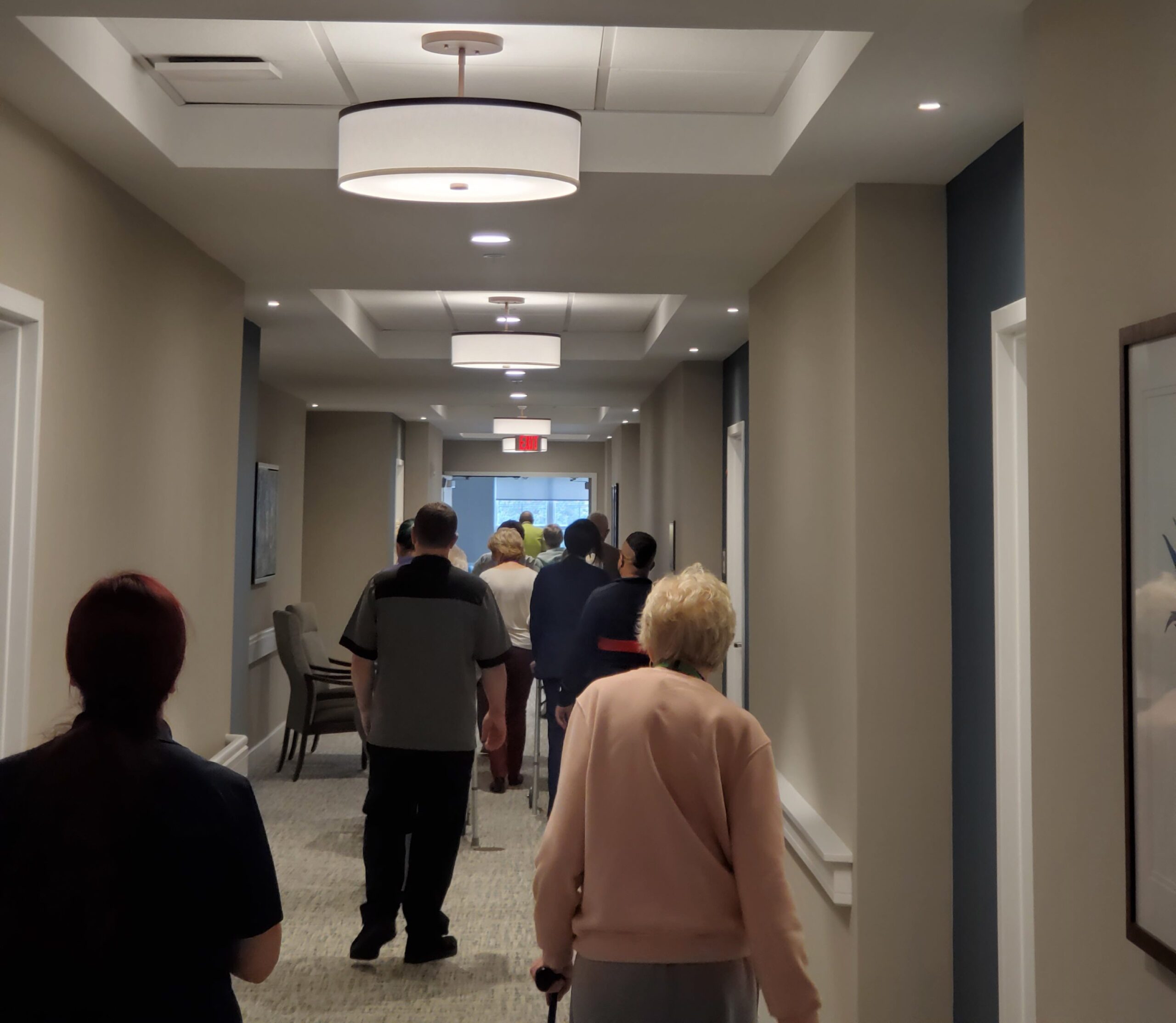 Residents walking in a hallway