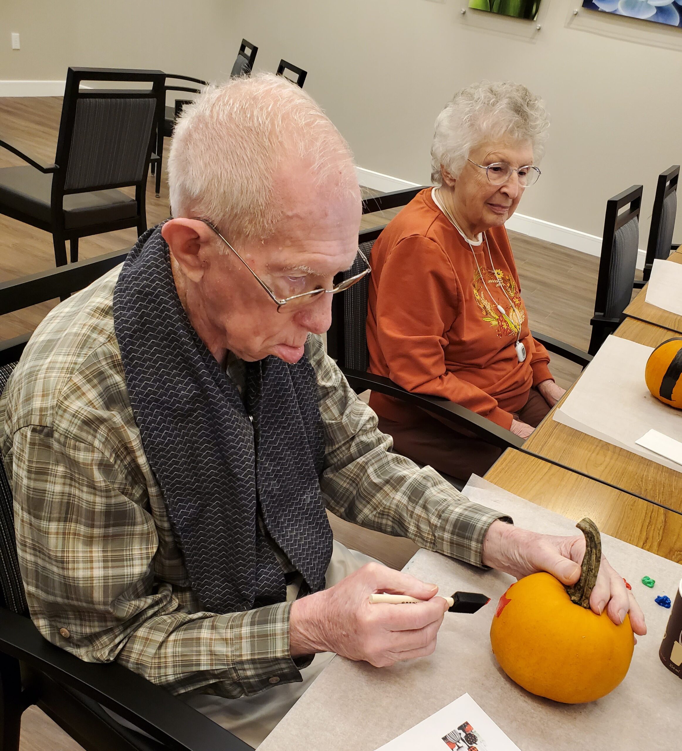 Residents participating in a fall-themed activity.