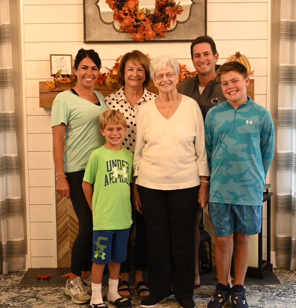 Family gathering with residents in a cozy interior.