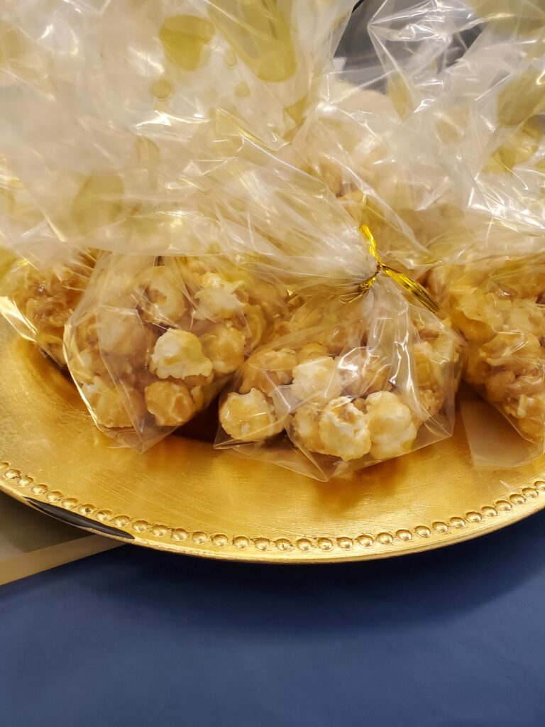 Bags of popcorn on a decorative plate.