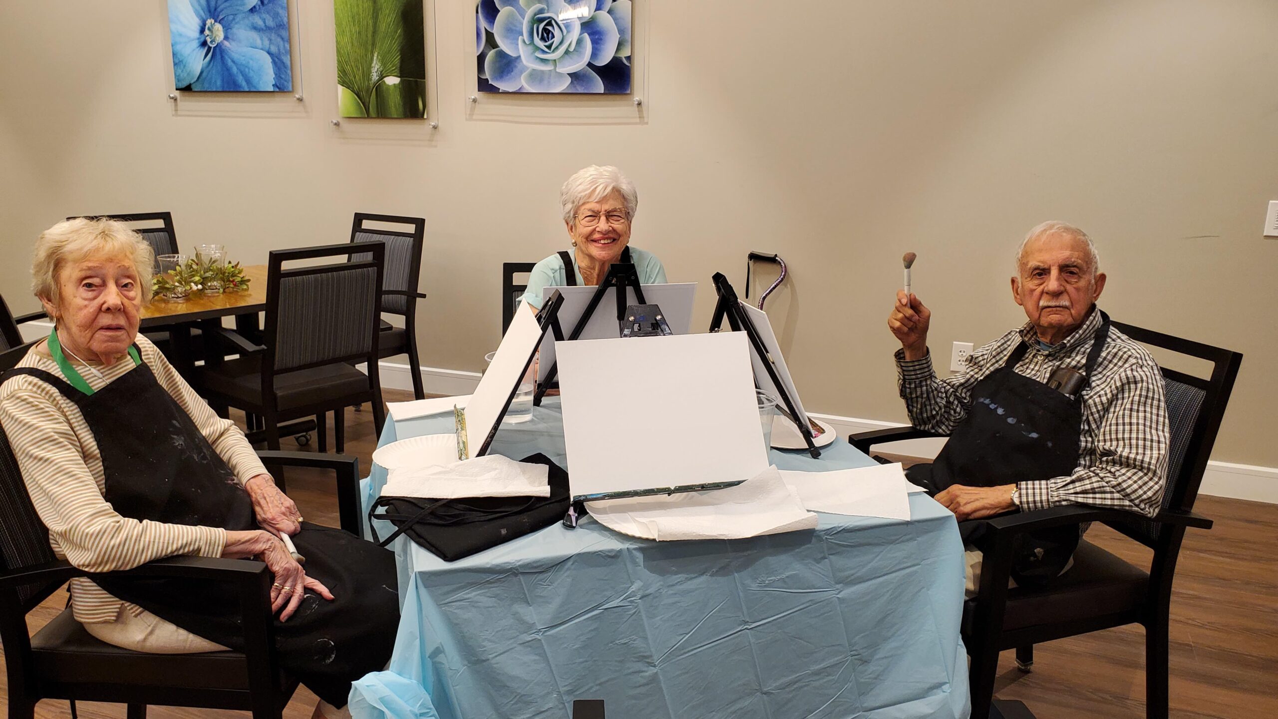 Residents engaged in a painting activity