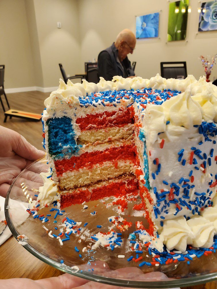 Celebratory cake with red, white, and blue layers.