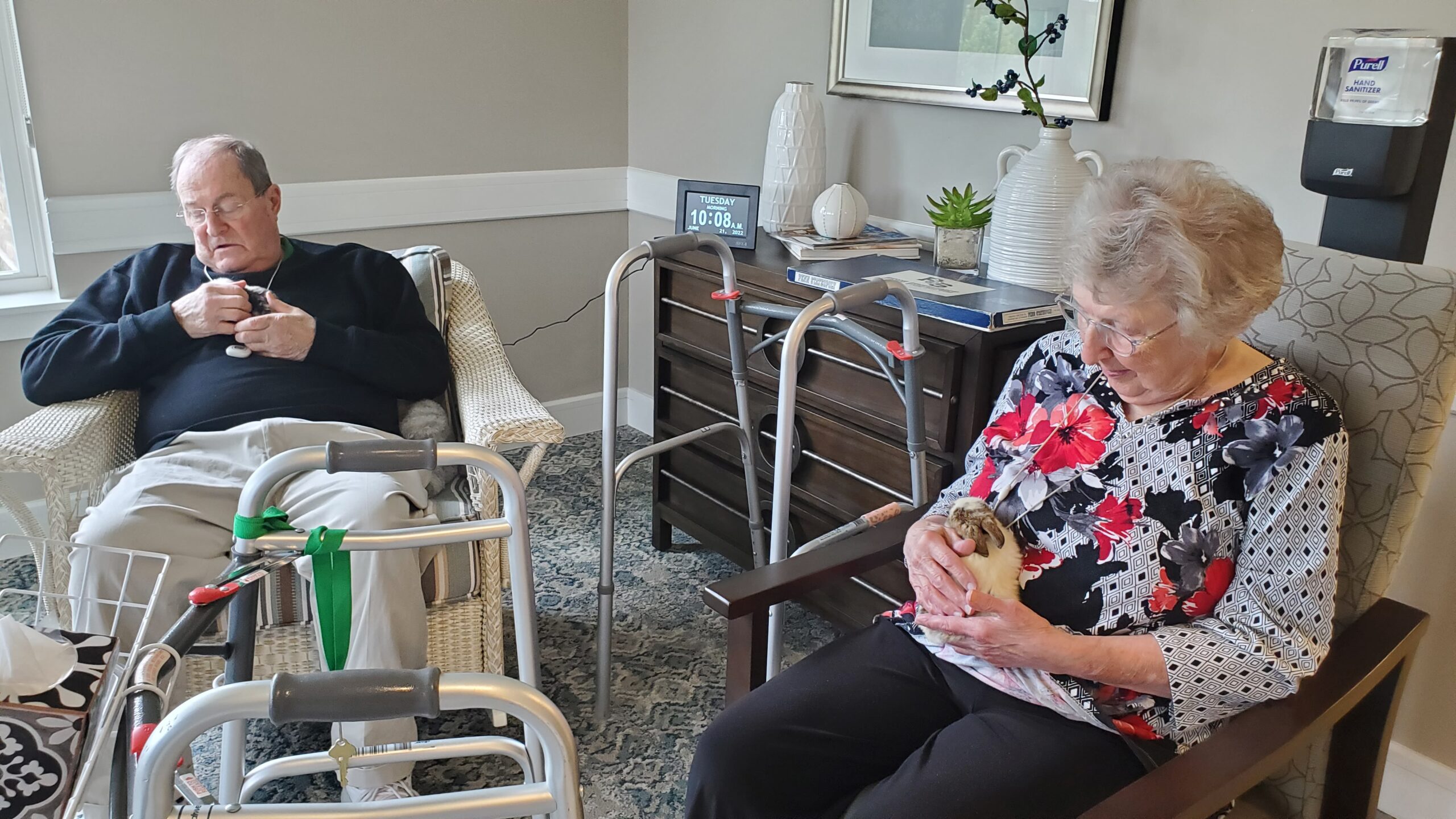Residents enjoying time together with a pet.