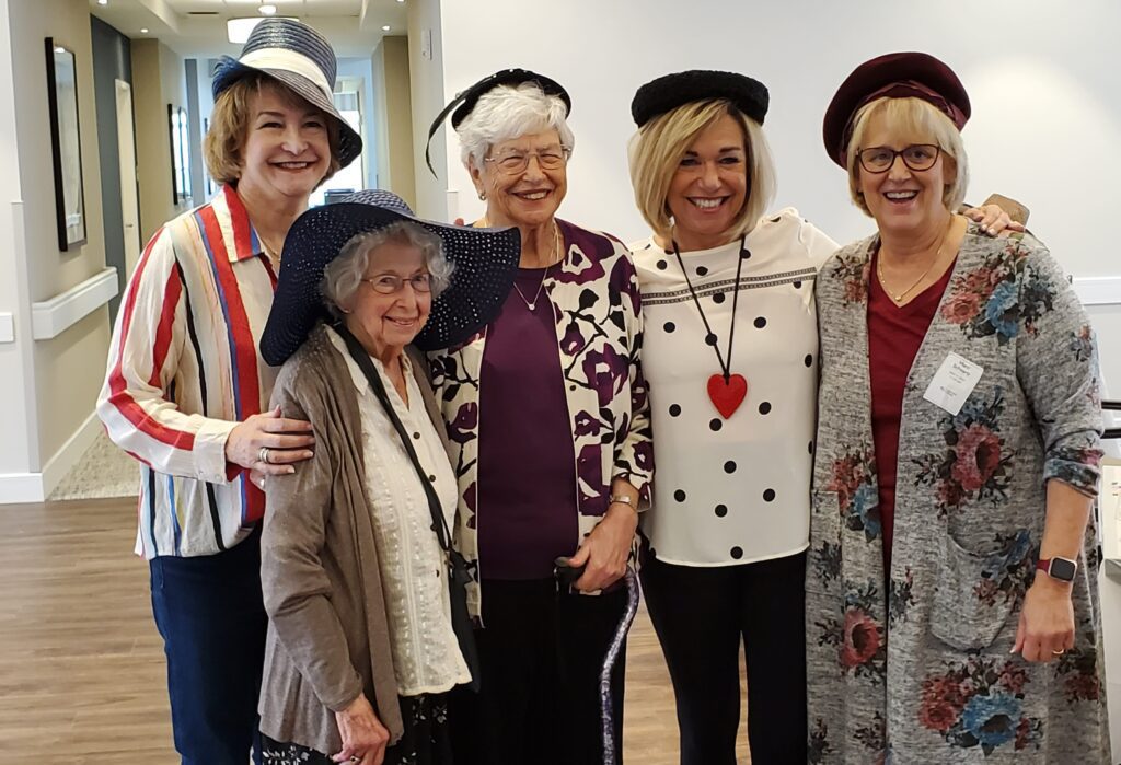 Residents and staff wearing festive hats