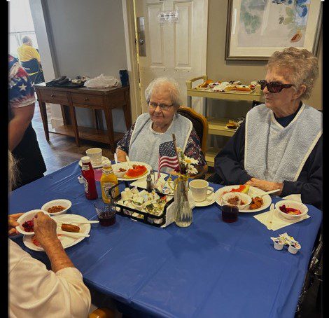 Residents enjoying a meal in the dining area.