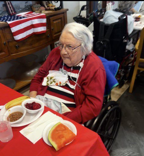 Resident enjoying a meal at the dining room