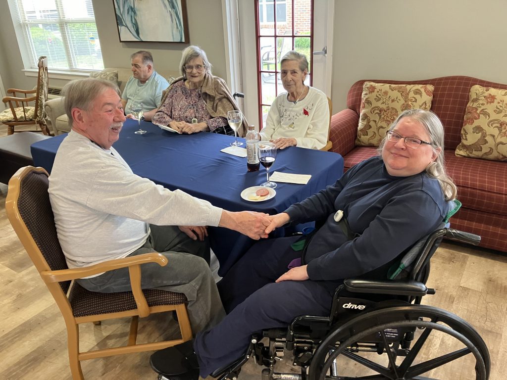 Residents and staff enjoying a social interaction