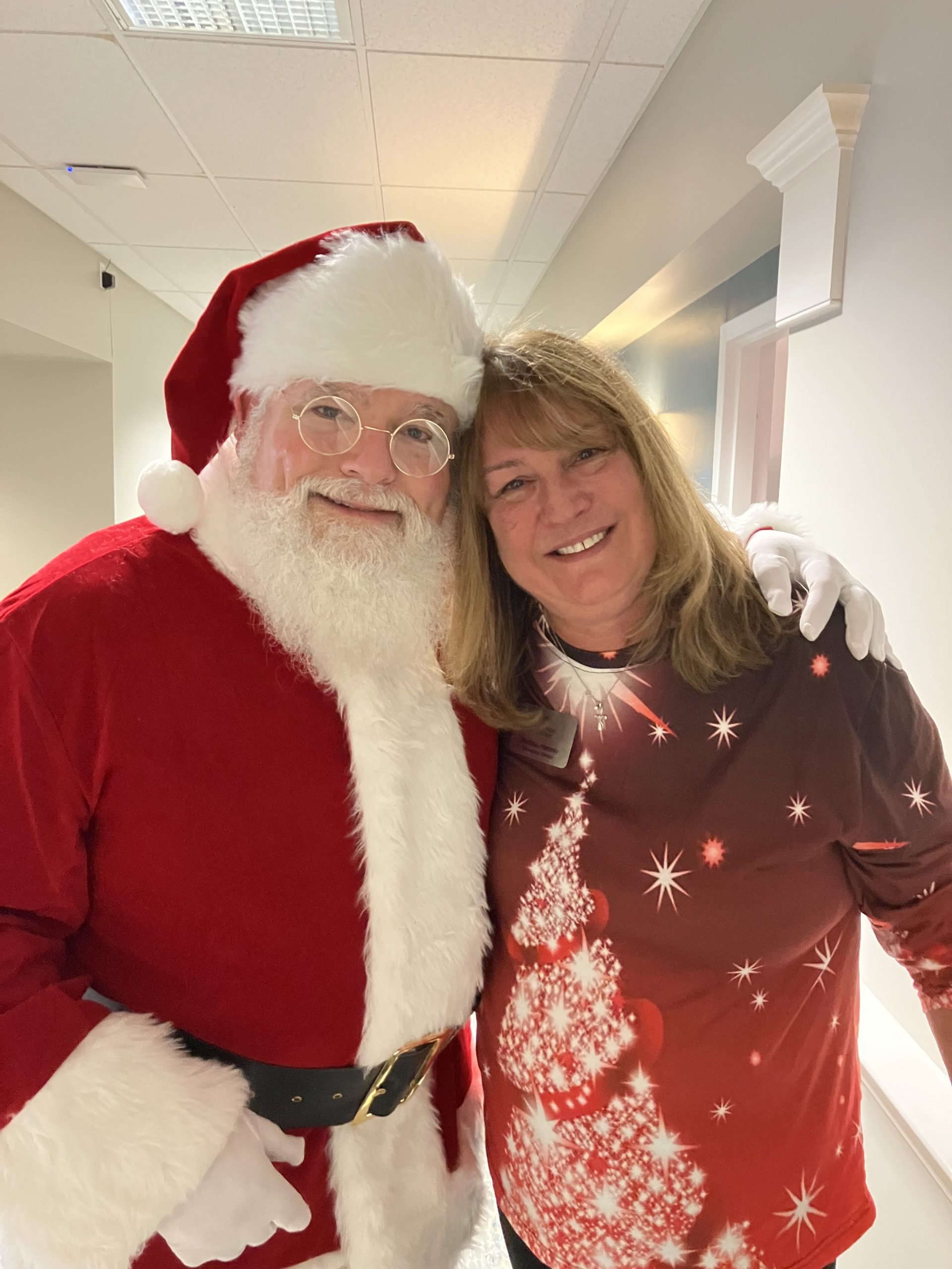 Resident and Santa Claus celebrating together