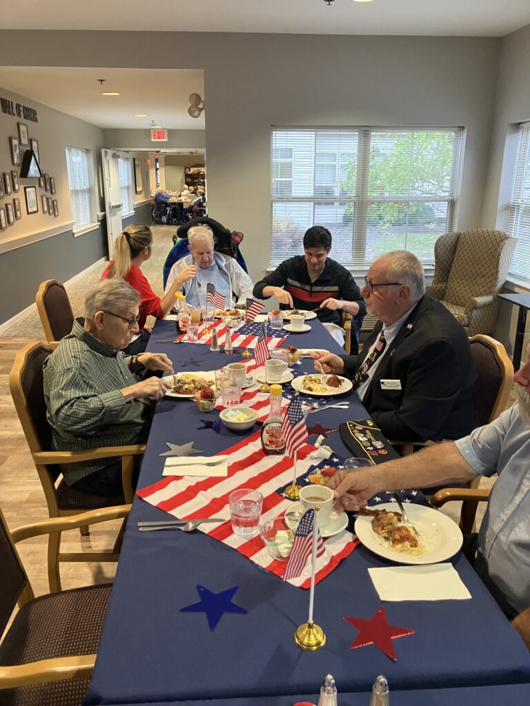 Residents enjoying a meal with decorations.