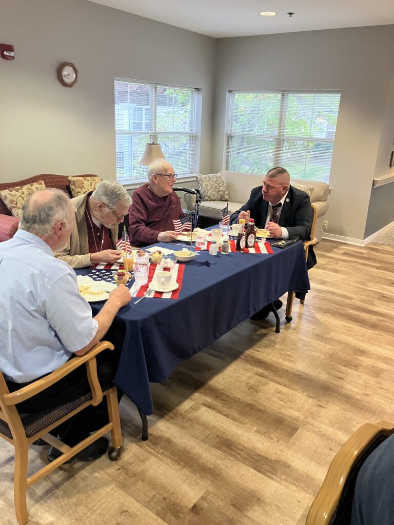 Residents enjoying a meal together at a table