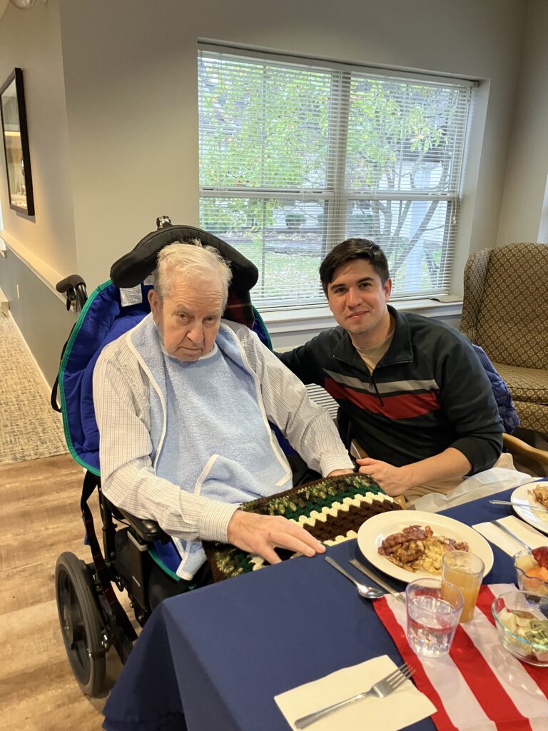 Resident enjoying a meal with a visitor.