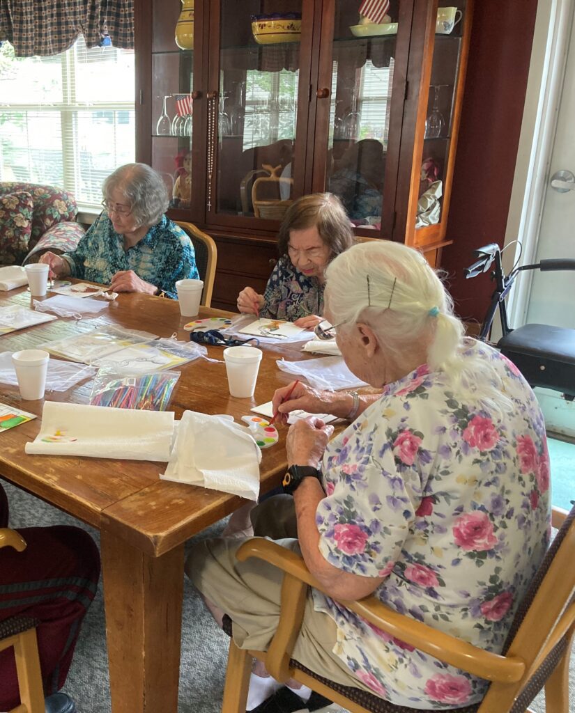 Residents engaged in an arts and crafts activity