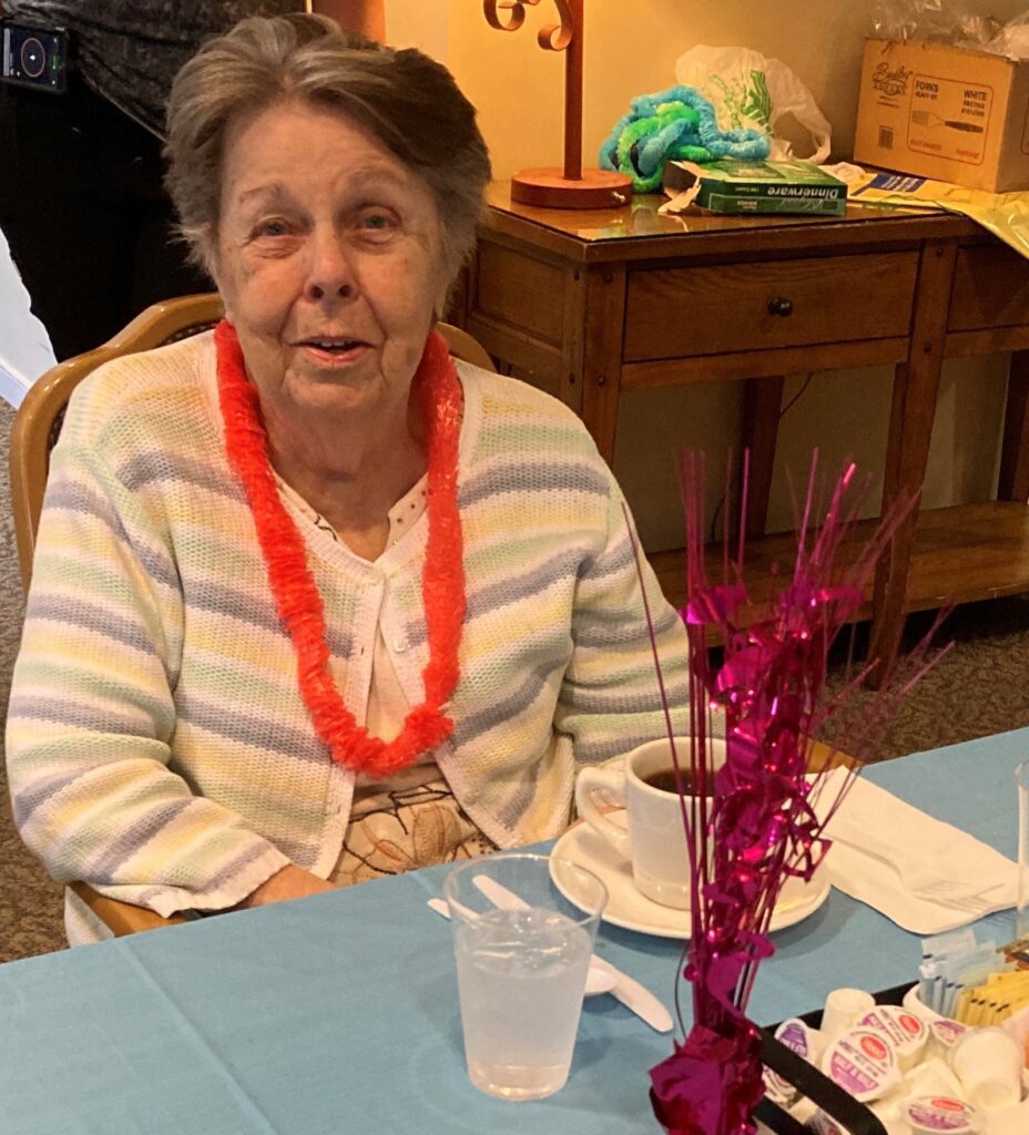 Resident enjoying a festive celebration indoors.