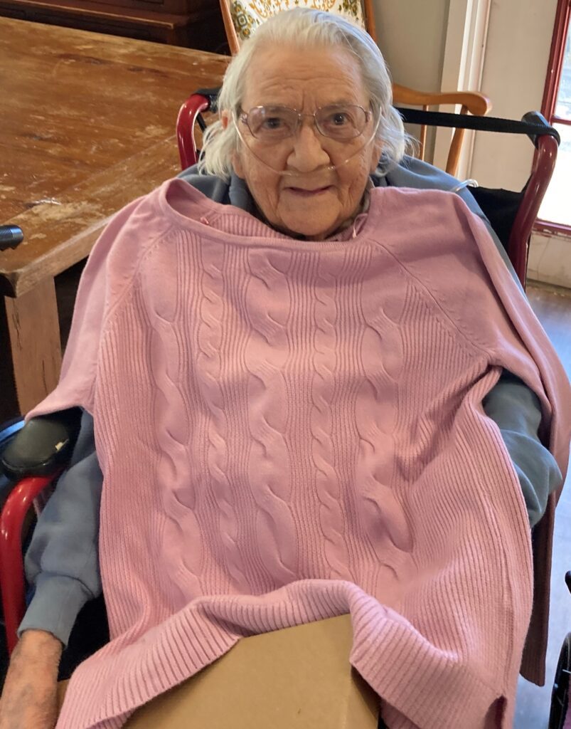 Smiling elderly woman in a wheelchair