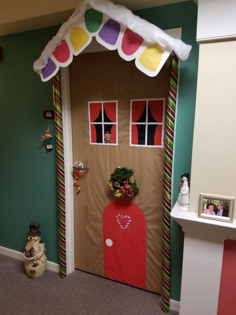 Decorated door resembling a gingerbread house