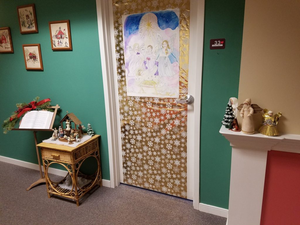 Decorated door in an interior hallway.