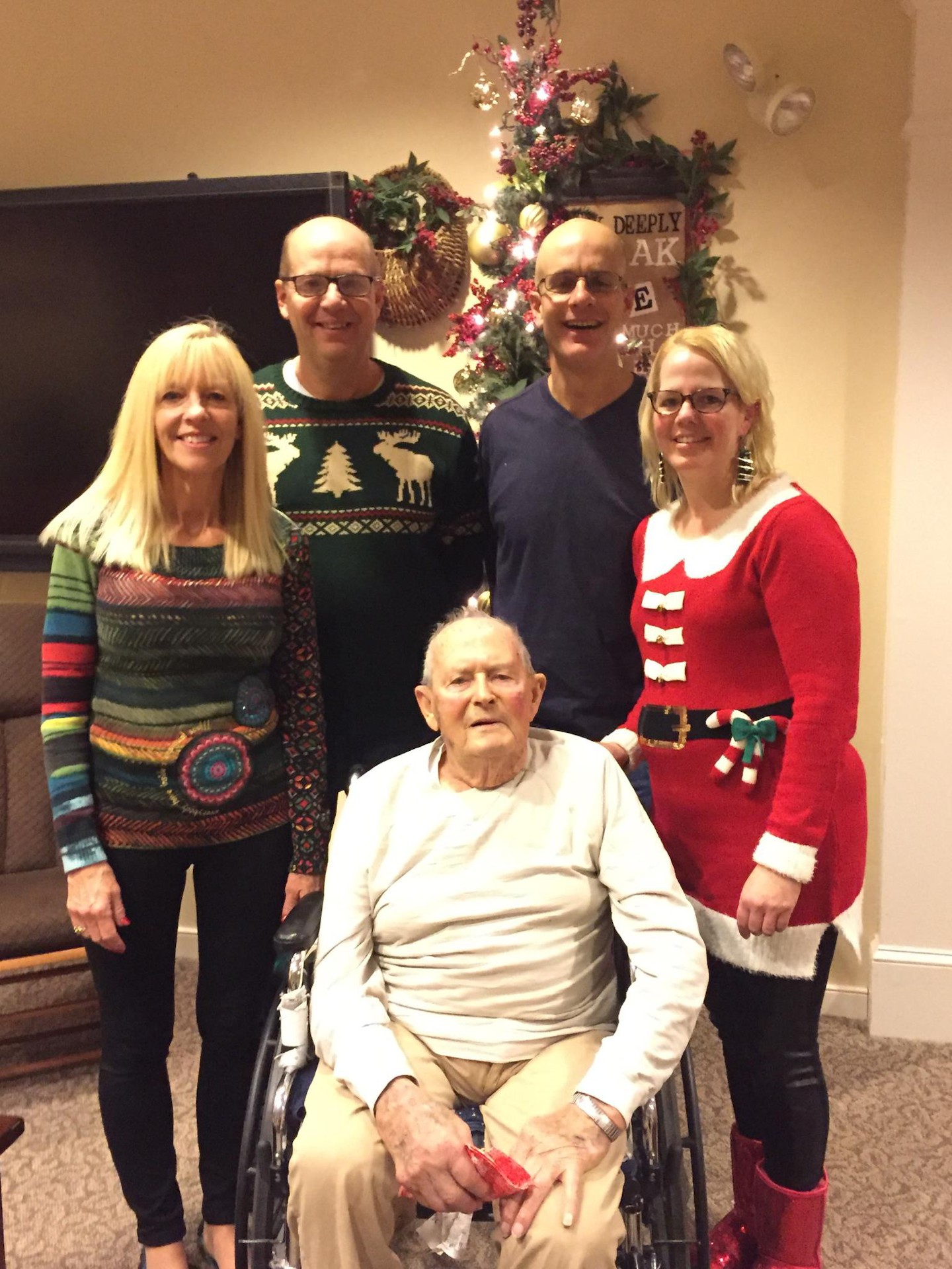 Residents and staff celebrating during a festive event.