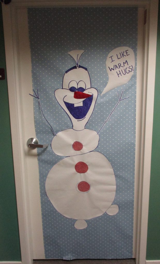 Door decorated with a snowman character.