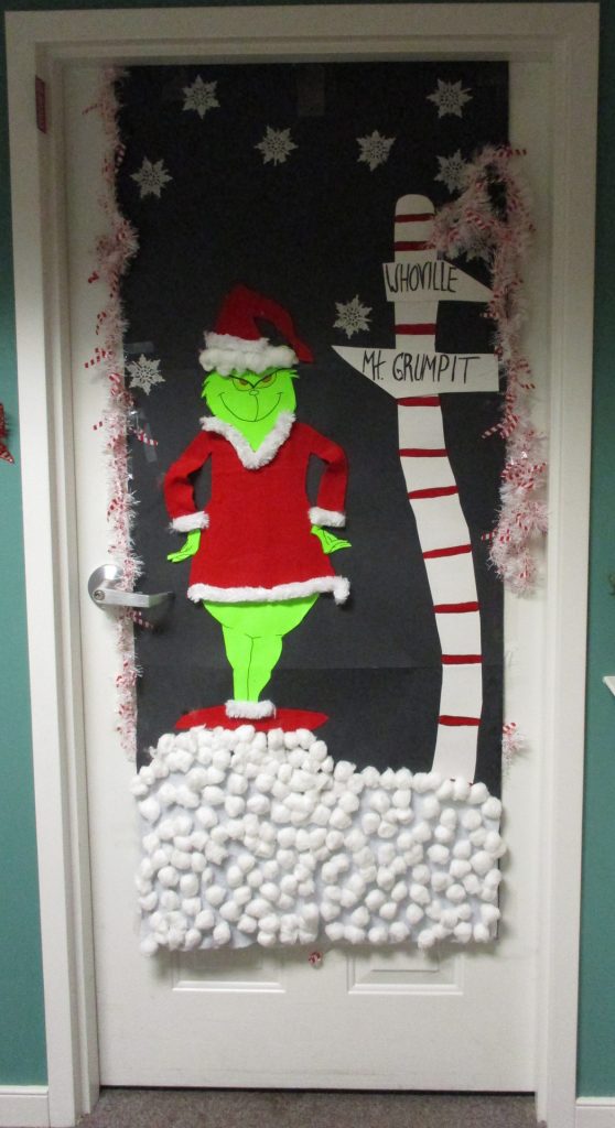 Decorative holiday door featuring the Grinch