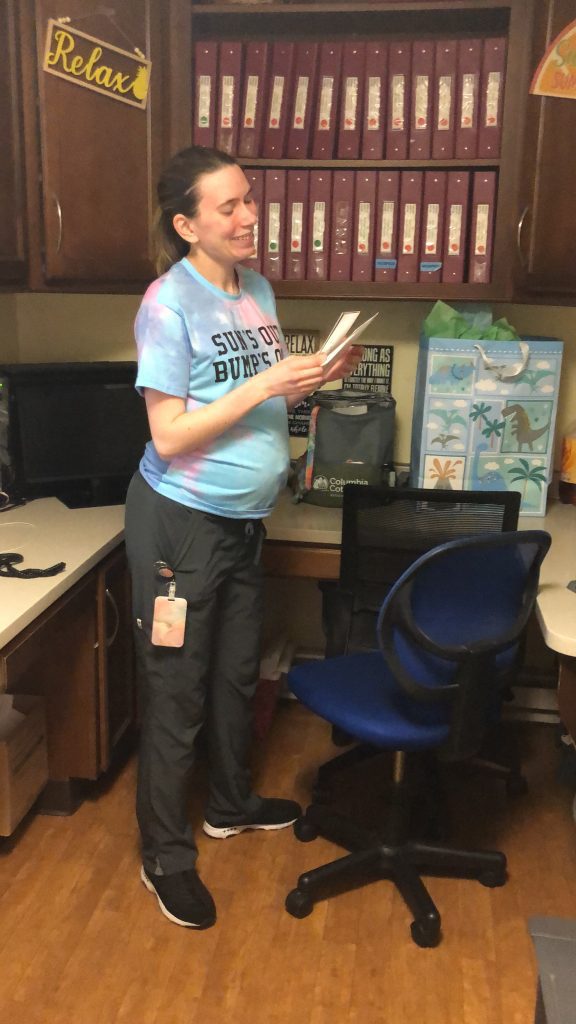 Staff member in office with organized shelves
