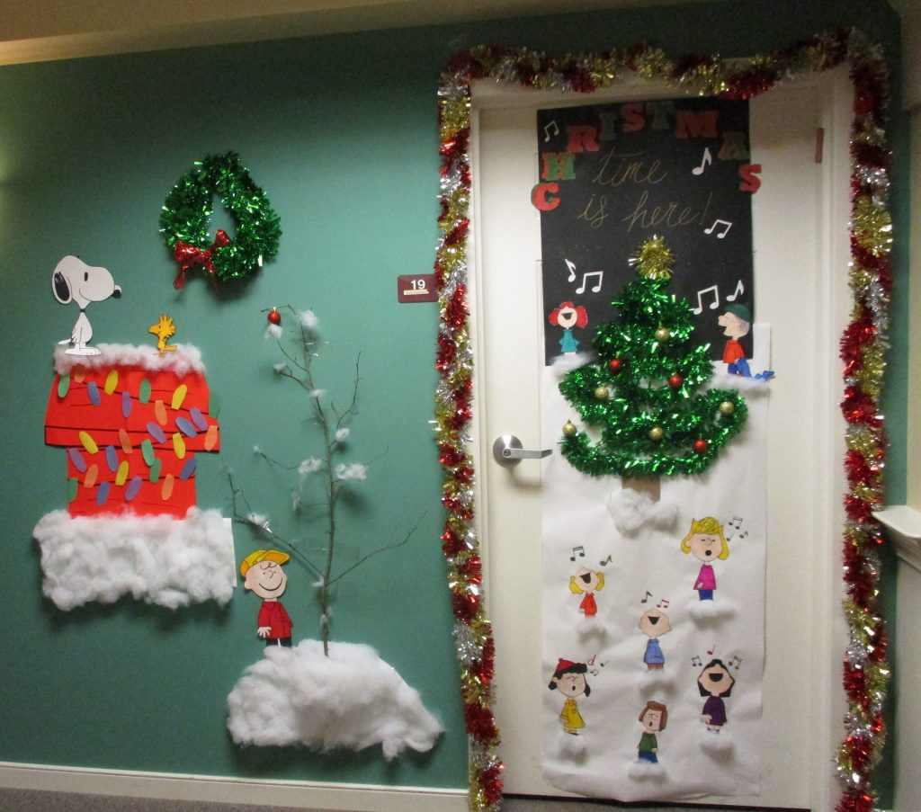 Decorated door with holiday-themed art