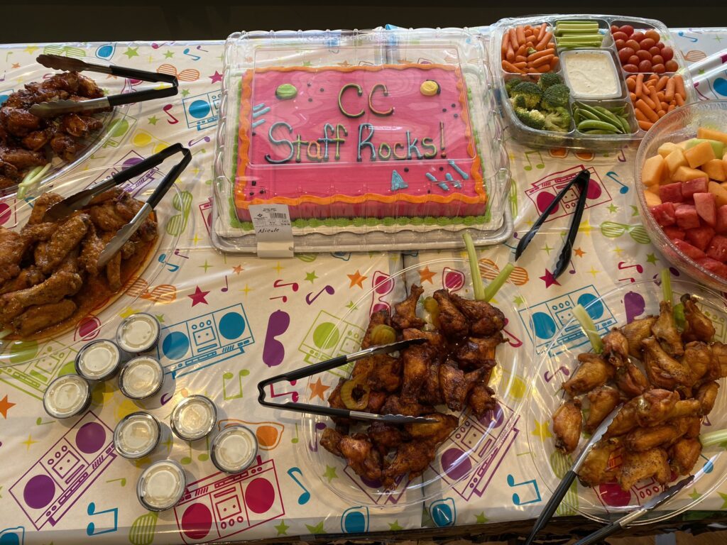 Celebratory food spread with cake and snacks.