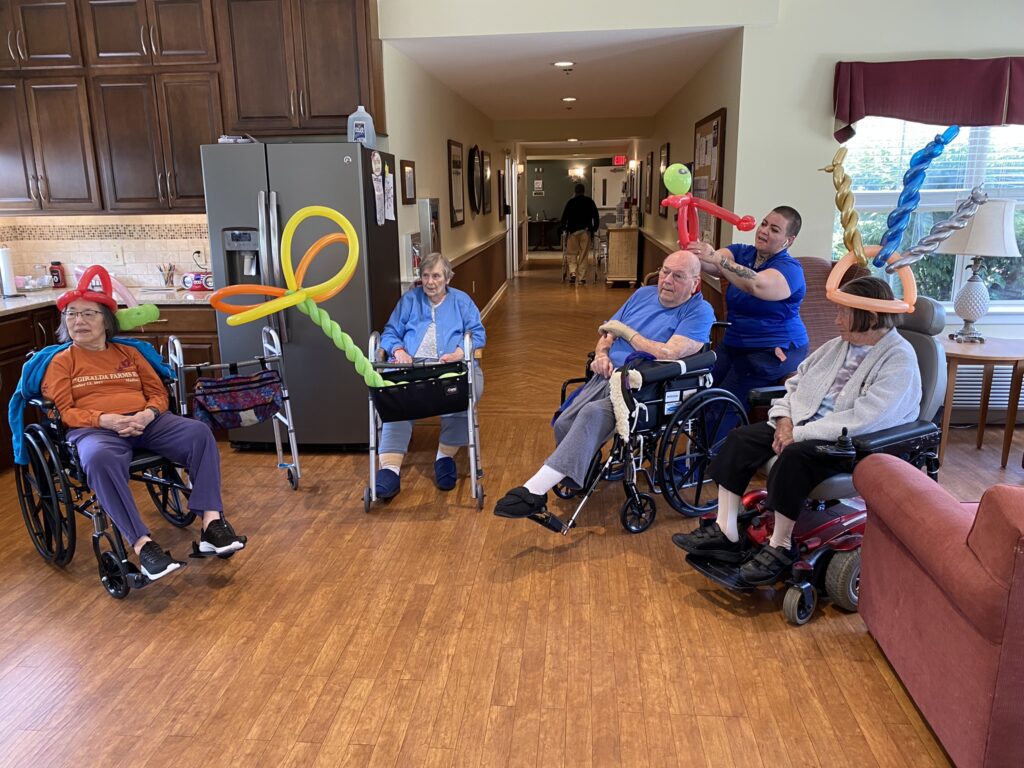 Residents enjoying a balloon activity indoors