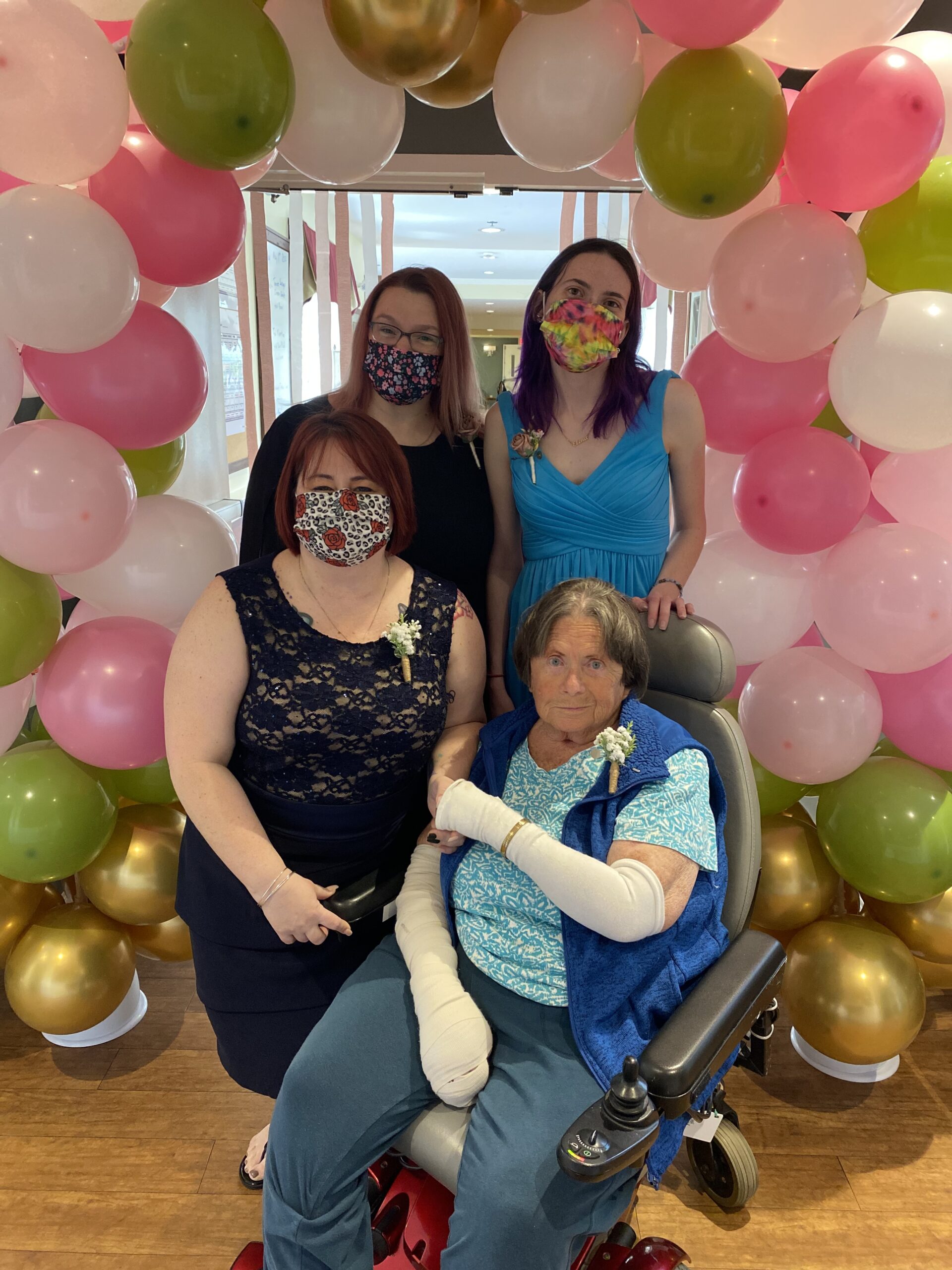 Residents and staff celebrating with balloons