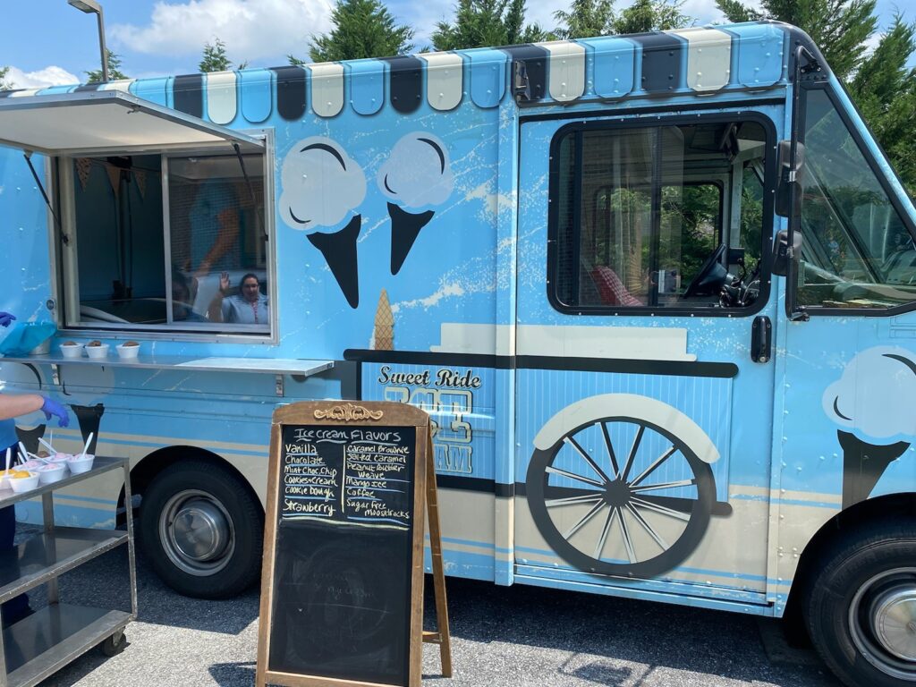 Ice cream truck with staff and residents