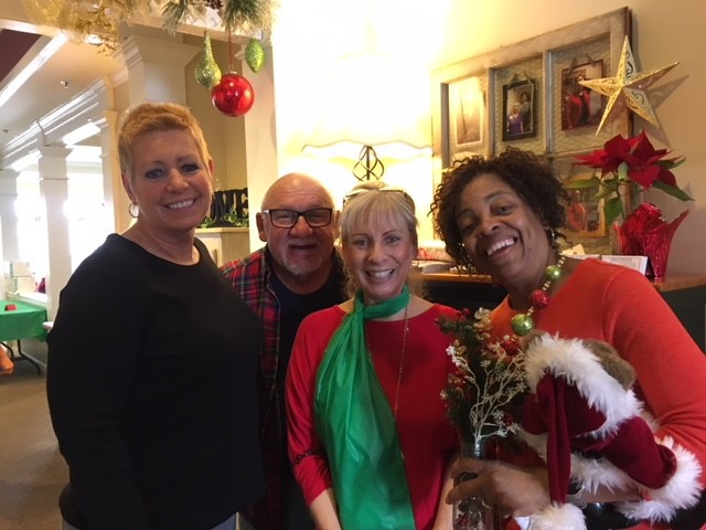 Staff members celebrating in a decorated common area.