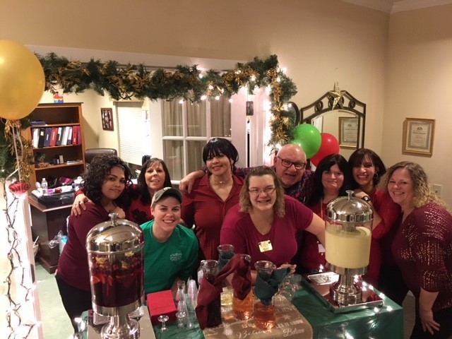 Staff members celebrating during a festive event