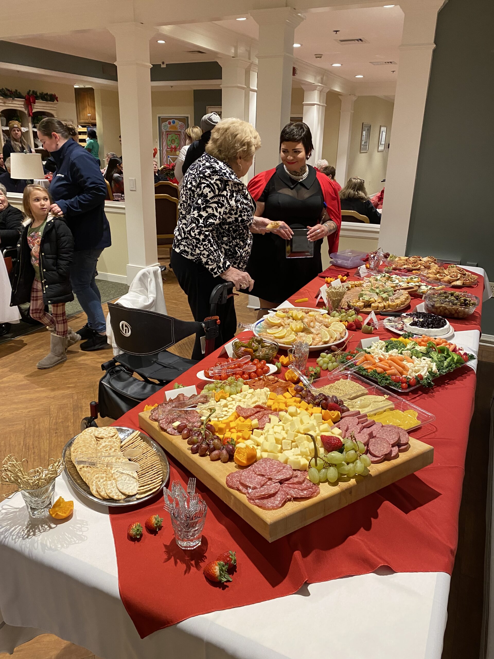 Residents and staff enjoying a festive meal together.