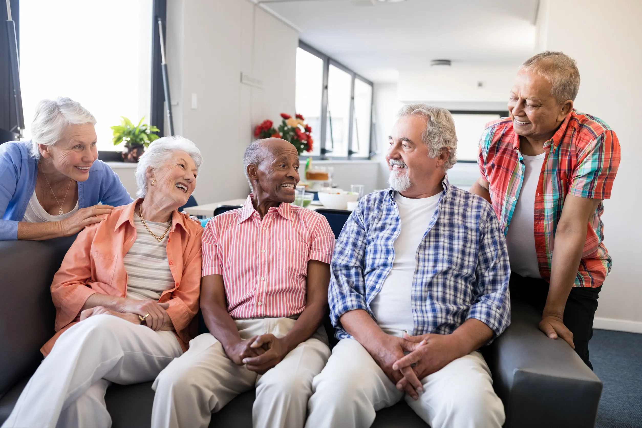 Residents laughing together in a common area