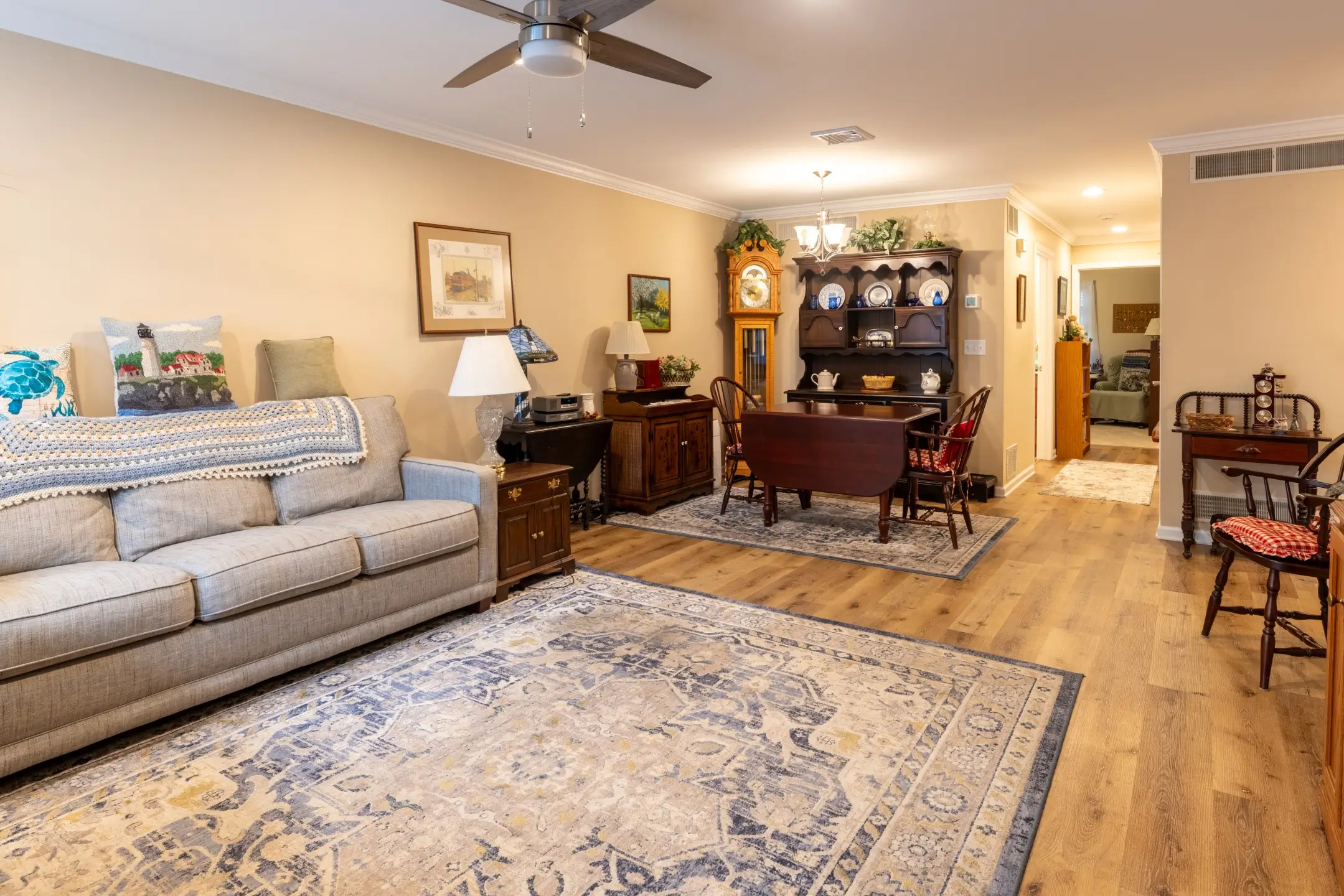 Interior view of a cozy common area with seating and dining table